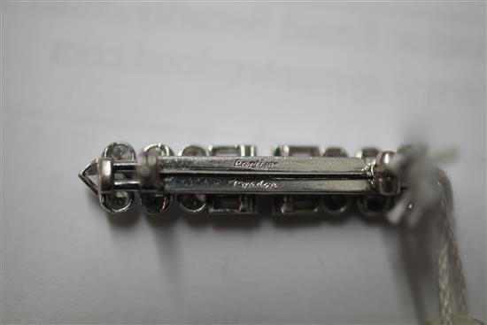 A mid 20th century Cartier platinum and diamond bar brooch, 36mm.